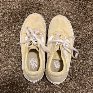Pastel yellow Vans off the wall